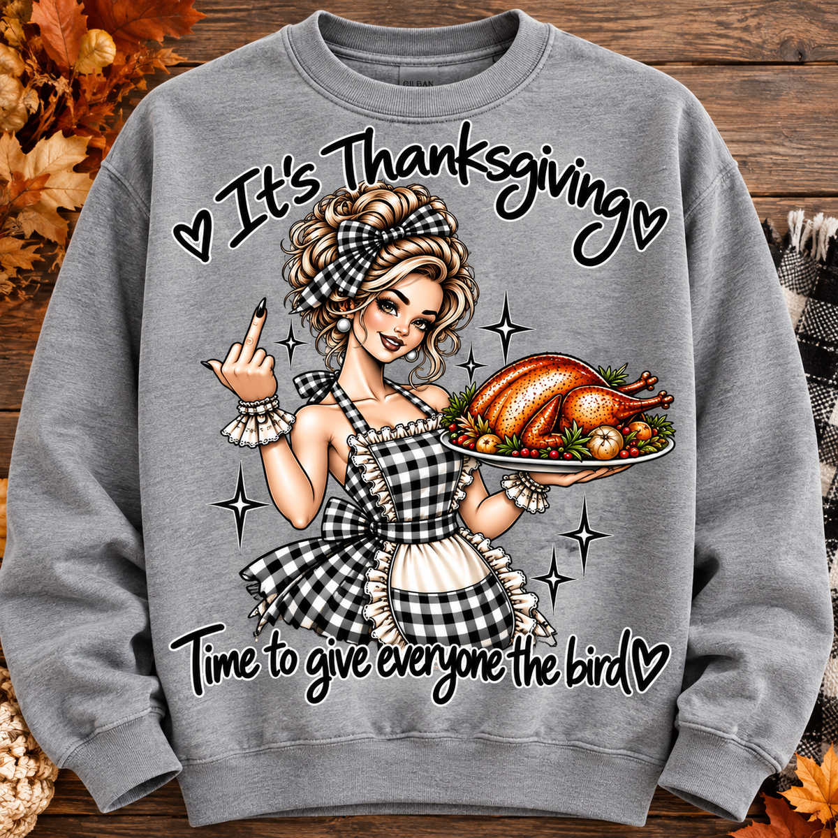 Grey Thanksgiving crewneck sweatshirt with gingham-clad pinup holding a turkey platter, giving the middle finger, and Time to give everyone the bird lettering